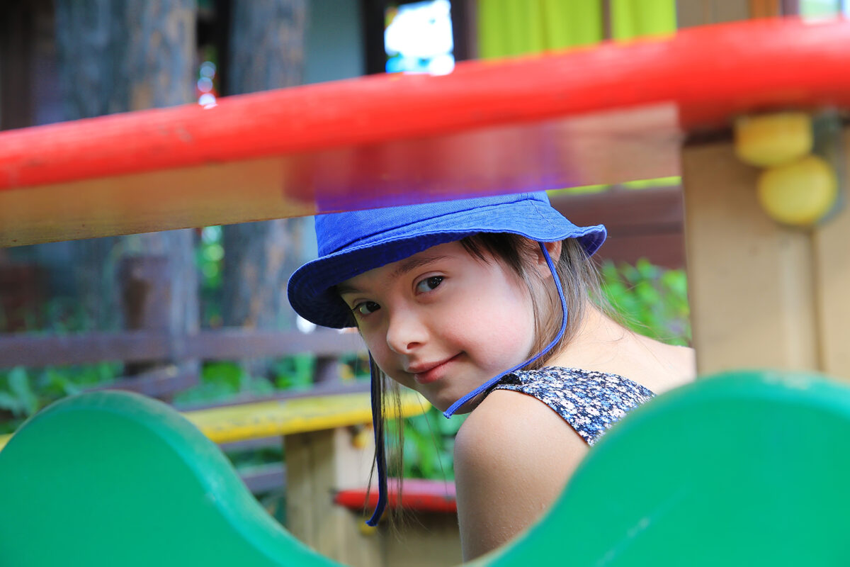 young girl smiling on playground